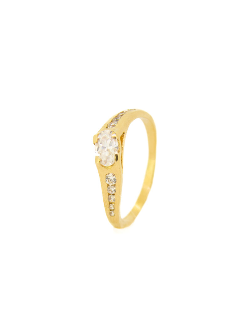 Anillo solitario oro18k girado con circonitas
