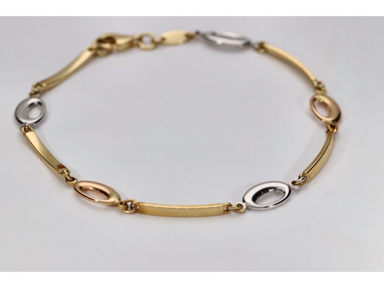 PULSERA ORO 18K TRICOLOR OBAL CALADO Y BARRA